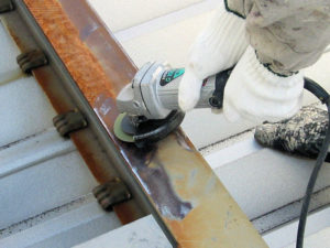 Remove all the rust and old paint film with a power tool.